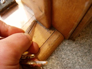 Grimy corners of wood floor