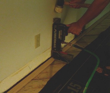 Installing hardwood floors near walls discount