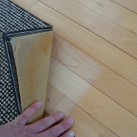 wood floor discolored under rug