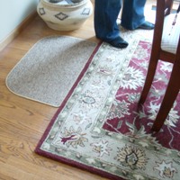 Dining room area rug under table