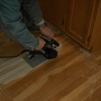 Floorwright cutting into wood floor for repair